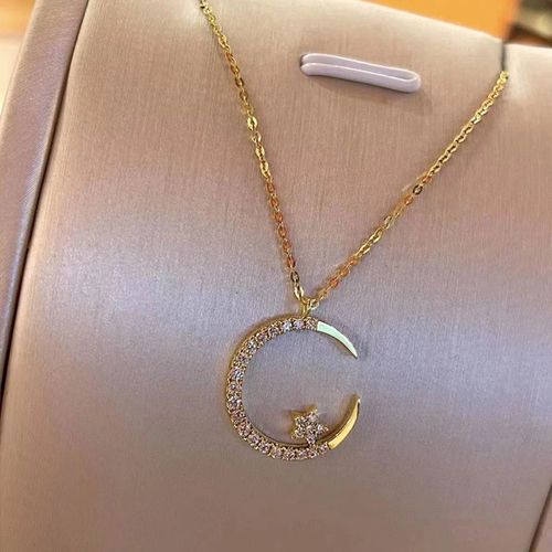 Glimmering Gold Star & Moon Necklace - Sparkle with Zircon Elegance