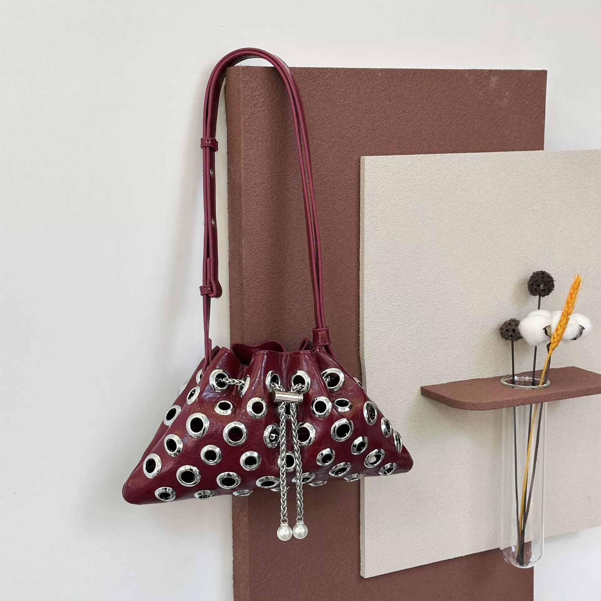 Metallic handbag, rivet shoulder bag, crossbody bag, hollow eyelet drawstring bucket bag for women