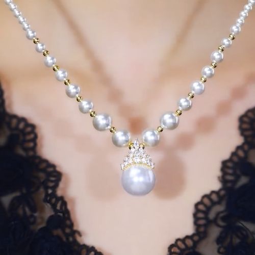 A pearl necklace, a graceful radiance on your neck.  A classic pearl necklace, a timeless expression of elegance.  A string of pearls, illuminating your elegant demeanor.