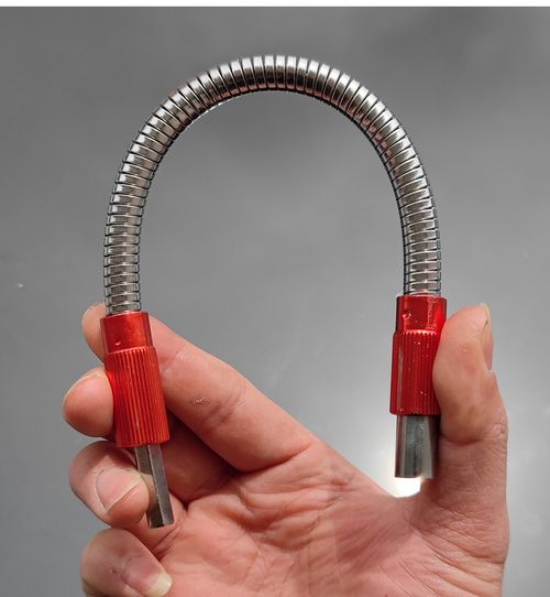 Universal metal screwdriver bit for electric drills and screwdrivers