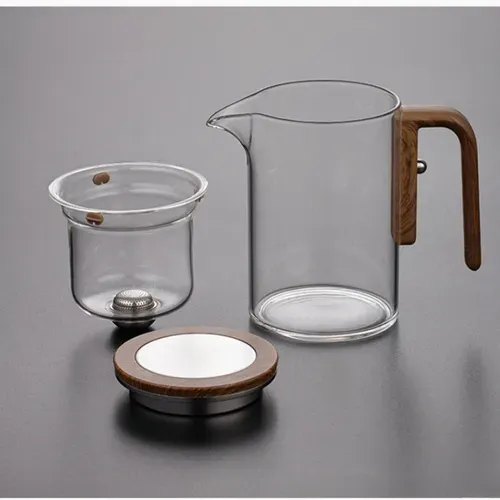 A high borosilicate glass teapot set used for soaking coffee, tea and fruits, with a magical heat-resistant wooden handle and a water separation function.