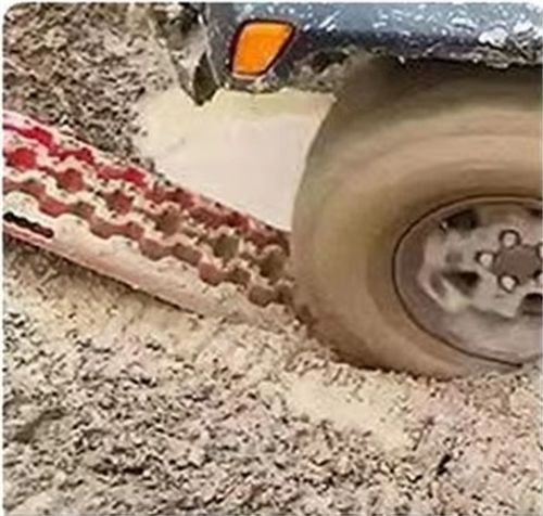 Outdoor vehicle recovery using traction boards