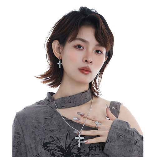 Fully encrusted sparkly crystals enshroud faith— the edgy highlight around your neck