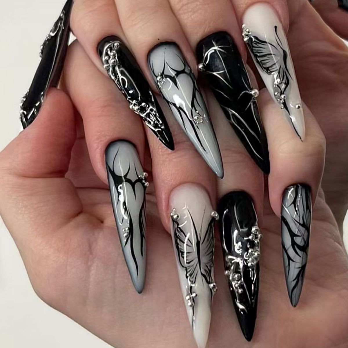 Dark style long almond-shaped wearable nails with silver steel bead butterfly prints and high-end false nail patches