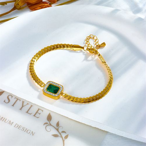 Fashionable women's gold jewelry set with green rhinestone pendant necklace, earrings, and bracelet as a gift.
