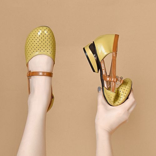 Designer's luxurious low-heeled women's sandals. Luxurious women's sandals