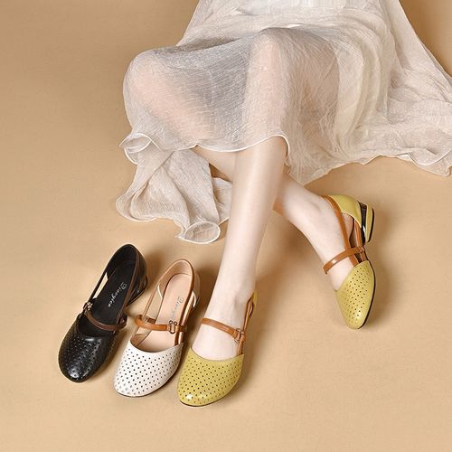 Designer's luxurious low-heeled women's sandals. Luxurious women's sandals