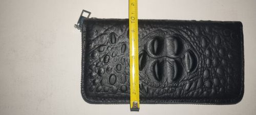 Unisex genuine leather zippered wallet with wrist strap: Features RFID-blocking technology and high-capacity storage, combining the functions of a personalized card holder, clutch, and phone pouch.