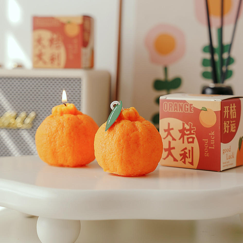 Orange-scented candles, perfect for holiday gifts, parties, and home décor.