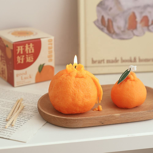 Orange-scented candles, perfect for holiday gifts, parties, and home décor.