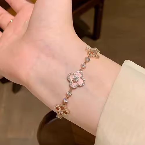 A luxurious retro style four-petal white, pink and red multi-colored crystal inlaid hollow adjustable length women's bracelet