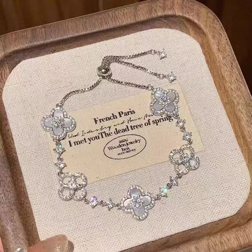 A luxurious retro style four-petal white, pink and red multi-colored crystal inlaid hollow adjustable length women's bracelet