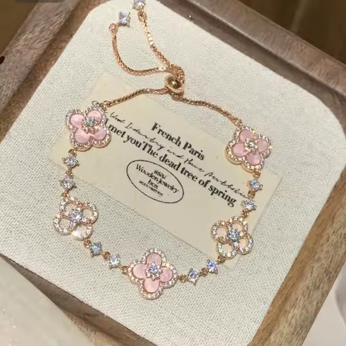 A luxurious retro style four-petal white, pink and red multi-colored crystal inlaid hollow adjustable length women's bracelet