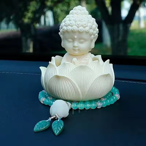 The statue of the Buddha riding in a lotus boat, the car center console decoration piece, the new high-end interior decoration items, peaceful and grand, with a touch of traditional Chinese style.