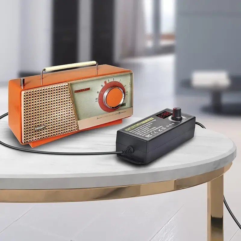 SnapFixMate Universal Power Supply, Plug Converter, Adjustable from 3.5 to 24V at 2A, AC to DC Adapter, US Power Plug, Featuring an LCD Screen And Digital Display, Includes Reverse Polarity Wiring And 14 Connectors