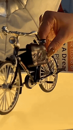 Retro-style old-fashioned bicycle model (with a large frame and two large wheels)