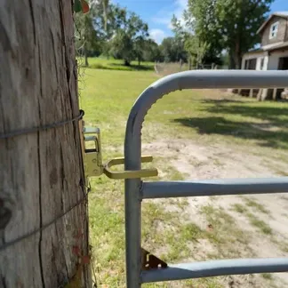 The lock prevents cattle, sheep, and horses from escaping the pasture.