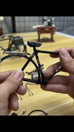 Retro-style old-fashioned bicycle model (with a large frame and two large wheels)