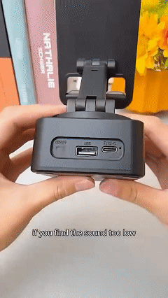 Three-in-one device: phone holder, Bluetooth speaker, and power bank.  Features include Bluetooth calling, USB drive functionality, and a rotatable, extendable, and foldable design.