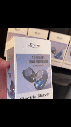 Mini electric shaver for men with digital battery level display.