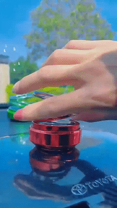 Solar-powered double-ring suspended rotating aromatherapy car air freshener with gradient lighting, long-lasting subtle fragrance, and decorative car interior ornament.