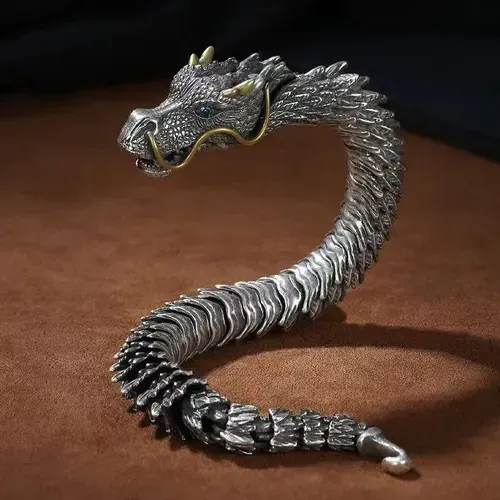 Dragon - shaped bracelet: winding dragon form, golden - horned & bearded head with blue gem eyes, retro and domineering design, dragon - scale - like texture, trendy men's jewelry.