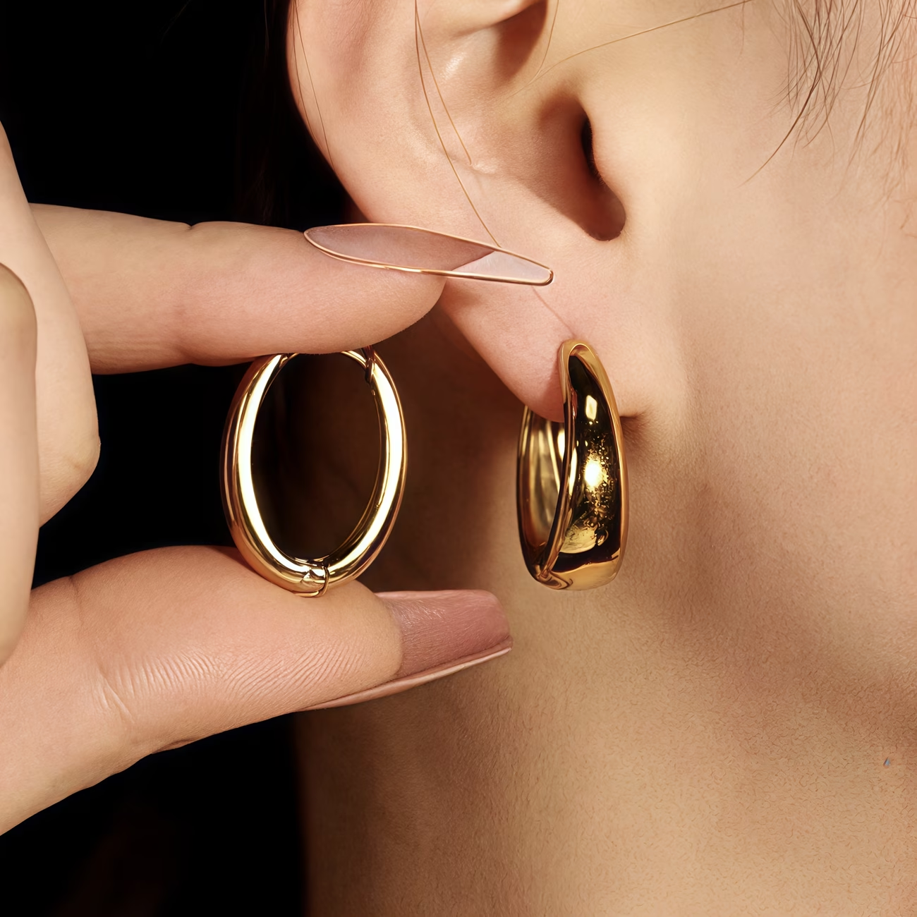 Golden oval-shaped lady's earrings