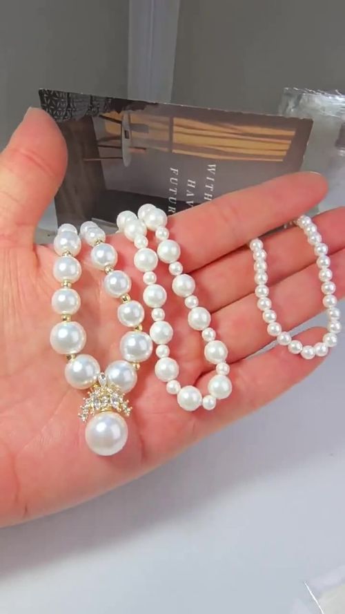 A pearl necklace, a graceful radiance on your neck.  A classic pearl necklace, a timeless expression of elegance.  A string of pearls, illuminating your elegant demeanor.